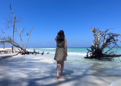 2022-05-26 USA Florida Beercan Island Gibby Point Beach tree trees ocean clear water woman white sand