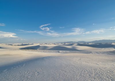 2022-06-10 USA New Mexico White Sands National Park sunset dunes desert white sand gypsum landscape sun clouds sky shades mountains
