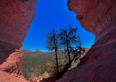 2022-06-13 USA Arizona Sedona Birthing Cave hike greenery landscape rocks red green trees cave
