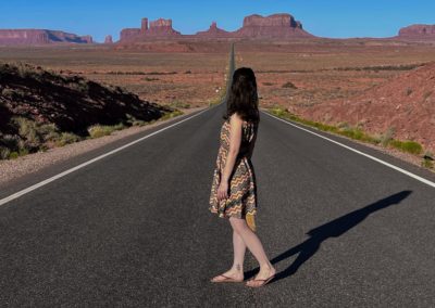 2022-06-20 USA Utah Monument Valley Forrest Gump Overlook road red rocks landscape woman