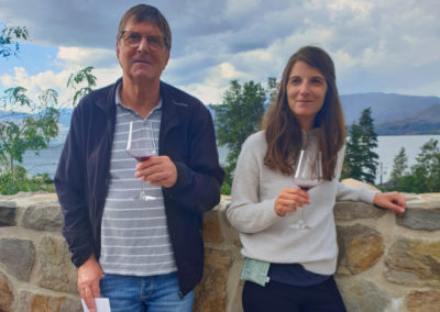 2022-08-27 Canada British Columbia Okanagan Valley Kelowna vineyards vines wine tasting man woman wine glasses Okanagan Lake