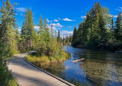 2022-09-05 Canada Alberta Canmore village town riverside walkway Policeman Creek river bridge Promenade nature water forest