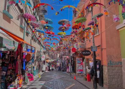 2022-10-12 Bolivia La Paz capital city Mercado de las Brujas Witches' Market street art street stores colors decorations umbrellas paragliders