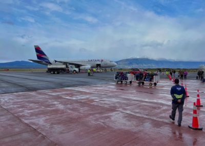 2022-11-25 Chile Patagonia Puerto Natales village flight Latam Calama Santiago de Chile Puerto Natales airport baggage arriving runway take off landing