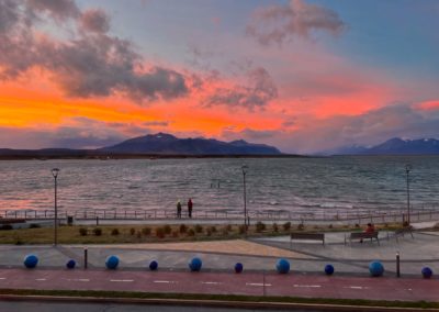 2023-01-05 Chile Patagonia Puerto Natales torres del paine national park village view sea ocean water coast mountains glacier snow sun sky blue viewpoint best sunset red colour clouds road village