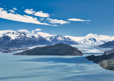 2023-01-11 Chile Patagonia Puerto Natales Torres del Paine National Park Parque Nacional the best the most beautiful hike magnificent trailMulti-day hike W-Trek day day stage 1 Lago Glacier Grey lake Grey mountains snow viewpoint observation point clouds blue sky